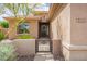 Exterior of home with a walkway leading to the front door through a gated entrance at 41202 N Rolling Green Way, Anthem, AZ 85086