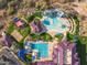 Aerial view of community pools, water slides, and recreation areas, offering resort-style amenities for residents at 41202 N Rolling Green Way, Anthem, AZ 85086
