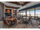 Spacious restaurant area boasts abundant seating, natural light, and stunning views of the surrounding landscape at 41202 N Rolling Green Way, Anthem, AZ 85086