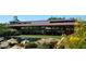 Quaint Daisy Mountain Railroad station with lush landscaping, water feature, and charming details at 41202 N Rolling Green Way, Anthem, AZ 85086