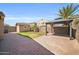 Spacious backyard showcasing a gazebo, storage shed, manicured lawn, and mature palm tree at 4232 S 103Rd Ln, Tolleson, AZ 85353