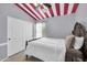 Cozy bedroom with patterned ceiling, closet, and neutral decor at 4232 S 103Rd Ln, Tolleson, AZ 85353