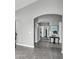 Inviting hallway with arched entryway, tasteful decor, and tile flooring leading to various rooms at 4232 S 103Rd Ln, Tolleson, AZ 85353