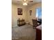 Comfortable bedroom with neutral walls, carpet flooring, a ceiling fan, and a window offering natural light at 426 W Pontiac W Dr # 4, Phoenix, AZ 85027