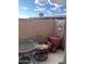 Enclosed patio with outdoor seating area, potted plants, and decorative cross at 426 W Pontiac W Dr # 4, Phoenix, AZ 85027