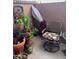 Private patio with mature plants, colorful pots, and a comfortable seating area at 426 W Pontiac W Dr # 4, Phoenix, AZ 85027