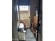 Enclosed sun room with a tiled floor, white lattice security door, and storage creates a bright indoor-outdoor transition at 426 W Pontiac W Dr # 4, Phoenix, AZ 85027