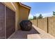 Backyard featuring a brick wall, rock landscape, patio, and covered barbecue at 4349 E Selena Dr, Phoenix, AZ 85050