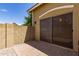 Back patio with sliding glass door, brick pavers, and block wall for privacy at 4349 E Selena Dr, Phoenix, AZ 85050