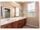 Bathroom featuring dual vanity sinks and large mirror at 4349 E Selena Dr, Phoenix, AZ 85050