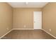 Neutral bedroom featuring tile floors and a white door at 4349 E Selena Dr, Phoenix, AZ 85050