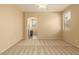 Large bedroom featuring three windows providing natural light and an arched entrance to an en-suite bathroom at 4349 E Selena Dr, Phoenix, AZ 85050