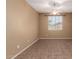 Neutral bedroom featuring tile floors, a ceiling fan, and window at 4349 E Selena Dr, Phoenix, AZ 85050
