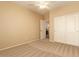 Cozy bedroom features neutral colors, standard closet, and door to an en-suite bathroom for added convenience at 4349 E Selena Dr, Phoenix, AZ 85050