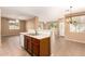 Open concept kitchen with stainless steel appliances and tile flooring at 4349 E Selena Dr, Phoenix, AZ 85050