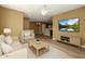 Inviting living room featuring hardwood floors, ceiling fan, and seamless flow into the dining and kitchen areas at 4349 E Selena Dr, Phoenix, AZ 85050