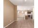 Spacious living room with tile flooring offering a view into the kitchen with stainless appliances at 4349 E Selena Dr, Phoenix, AZ 85050