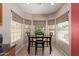 Bright breakfast nook with large windows offering plenty of natural light and a cozy dining space at 45028 W Cypress Ln, Maricopa, AZ 85139