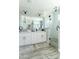 Modern bathroom featuring a glass-enclosed shower, double vanity, and sleek finishes for a spa-like experience at 4817 N 35Th St, Phoenix, AZ 85018
