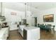 Well-lit kitchen with a large island, stainless steel appliances, and a dining area, perfect for entertaining at 4817 N 35Th St, Phoenix, AZ 85018
