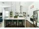 Bright, spacious kitchen with white cabinets, marble countertops, and a center island at 4817 N 35Th St, Phoenix, AZ 85018