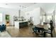 Bright, open kitchen featuring a large island with seating, stainless steel appliances, and wood flooring at 4817 N 35Th St, Phoenix, AZ 85018