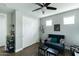 Open living room area features hardwood flooring, a dark blue sofa, with access to natural light at 4817 N 35Th St, Phoenix, AZ 85018