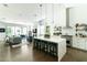 Bright open floor plan features a kitchen island, dining area, and living room at 4817 N 35Th St, Phoenix, AZ 85018