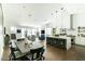 Open floor plan with kitchen island, dining area, and living room in a bright space at 4817 N 35Th St, Phoenix, AZ 85018