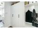 Functional mudroom with built-in storage, including cabinets and open shelving, for organization at 4817 N 35Th St, Phoenix, AZ 85018
