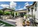 Inviting outdoor patio with a built-in grill area, comfortable seating, and lush landscaping at 4817 N 35Th St, Phoenix, AZ 85018