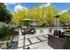 Cozy outdoor patio area with modern furniture, a heater, and vibrant landscaping, perfect for outdoor enjoyment at 4817 N 35Th St, Phoenix, AZ 85018