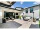 Spacious patio with outdoor seating, a mounted TV, and a serene setting for entertaining at 4817 N 35Th St, Phoenix, AZ 85018