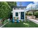 Cozy backyard shed featuring a charming bench, lush greenery, and an inviting outdoor space at 4817 N 35Th St, Phoenix, AZ 85018