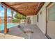 Covered back patio overlooking the pool, creating an ideal spot for outdoor lounging at 5126 W Las Palmaritas Dr, Glendale, AZ 85302