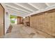 Covered back patio with concrete flooring and block wall, perfect for outdoor entertaining at 5126 W Las Palmaritas Dr, Glendale, AZ 85302