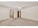 Bright bedroom with ceiling fan and ensuite bathroom at 5126 W Las Palmaritas Dr, Glendale, AZ 85302