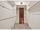 Walk-in closet with custom shelving and hanging space for ample storage solutions at 5126 W Las Palmaritas Dr, Glendale, AZ 85302