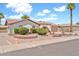 A well-maintained, single-story home featuring manicured desert landscaping and a two-car garage at 5126 W Las Palmaritas Dr, Glendale, AZ 85302