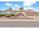 Charming single-story home featuring a tile roof and well-maintained desert landscaping in the front yard at 5126 W Las Palmaritas Dr, Glendale, AZ 85302