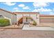 Charming single-story home with desert landscaping, arched entryway, and an attached two-car garage at 5126 W Las Palmaritas Dr, Glendale, AZ 85302