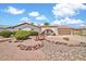 Charming single-story home showcasing desert landscaping, a red tile roof, and an attached two-car garage at 5126 W Las Palmaritas Dr, Glendale, AZ 85302