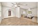 Inviting living area with neutral tile floors, recessed lighting, and seamless transitions into adjoining living spaces at 5126 W Las Palmaritas Dr, Glendale, AZ 85302