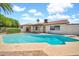 Spacious backyard pool featuring mature landscaping around the perimeter of the property at 5126 W Las Palmaritas Dr, Glendale, AZ 85302