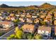 Extensive aerial view of a suburban community with varied home styles and mountain views at 5231 W Desperado Way, Phoenix, AZ 85083