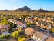 Community aerial view with mountain views and a sunny sky, highlighting neighborhood layout at 5231 W Desperado Way, Phoenix, AZ 85083
