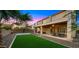 Expansive backyard with artificial turf, a basketball court, covered patio and ample space for entertaining at 5231 W Desperado Way, Phoenix, AZ 85083