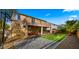 Wonderful backyard view including brick pavers, artificial turf, covered patio, and 2nd-story balcony at 5231 W Desperado Way, Phoenix, AZ 85083