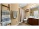 Cozy bathroom with a vanity, toilet, shower/tub combination, and decorative ladder shelf at 5231 W Desperado Way, Phoenix, AZ 85083