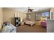 Bright bedroom featuring a cozy bed, study desk, ample natural light, and playful decor at 5231 W Desperado Way, Phoenix, AZ 85083